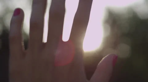 Hand in Sun Rays Stock Footage 39017339