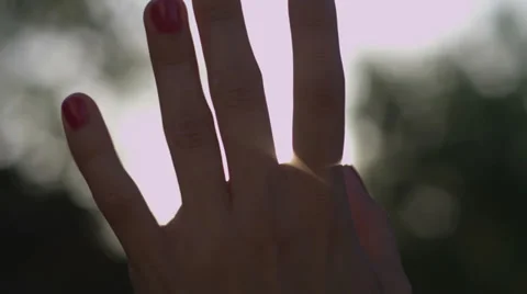 Hand in Sun Rays Stock Footage 39017616
