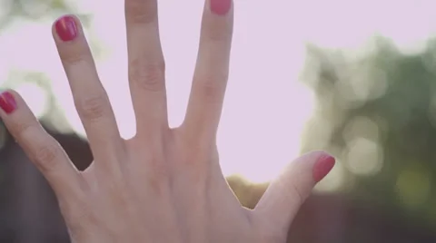Hand in Sun Rays Stock Footage 39017656