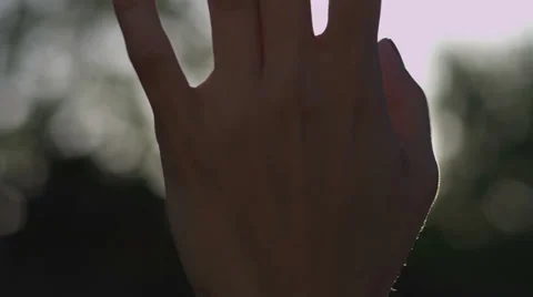 Hand in Sun Rays Stock Footage 39017732