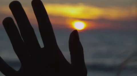 Hand in the sunset Video stock 41781776