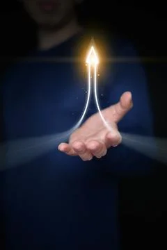 Hand supporting under bright glowing curved upward arrow with light particl.. Stock Photos