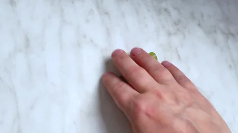 Hand Sweeping Chopped Celery Off A Marble Kitchen Counter Видео 342470127