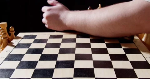 The hand sweeps away the chess pieces Stock Footage 239969185