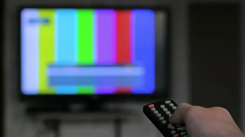 Hand switch channels by remote control. Unfocused TV, close up hand holding rc Stock Footage 171421669