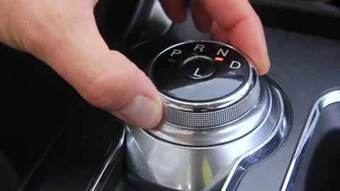 Hand switches the automatic transmission in a circle Stock Footage 140934313