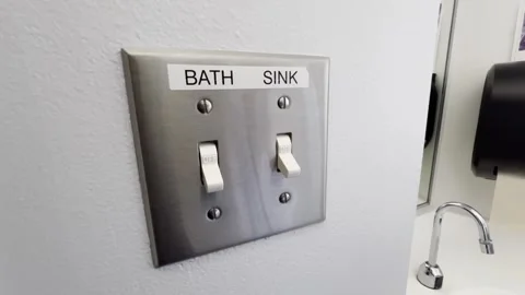 Hand switching bath and sink controls Video stock 332721611