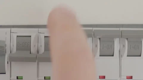 Hand switching circuit breaker in electrical distribution panel Stock Footage 332203561