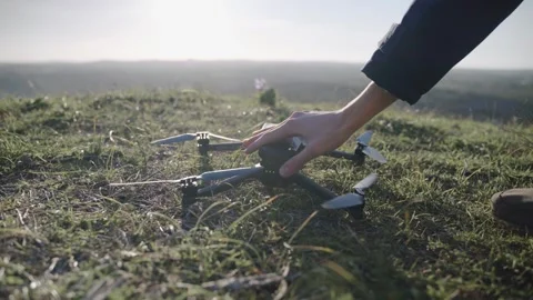 A hand switching on a drone to fly. Stock Footage 240397228