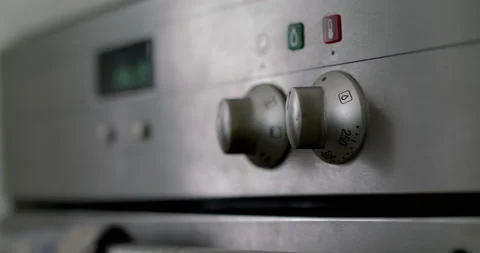 Hand switching oven knobs temperature Stock Footage 238847251