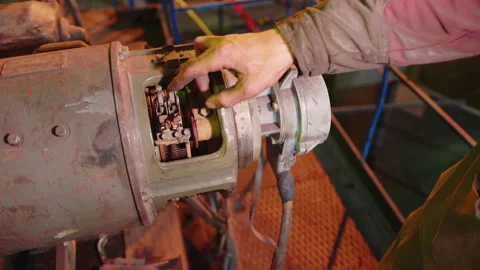 Hand switching power switch on a fusebox. Close up of electrician checking fuse Video stock 158930519