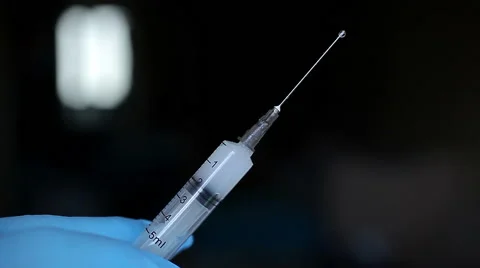 Hand with syringe Stock Footage 61628082