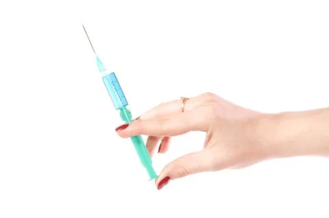 Hand with a syringe Stock Photos