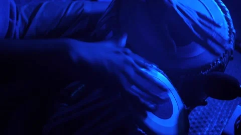 Hand of a table player drumming expressively with fingers, filmed with Stock Footage 214648925
