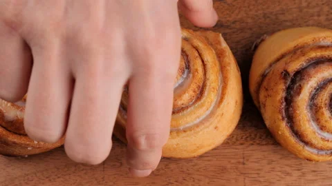 Hand take cinnamon rolls Stock-Footage 220712406