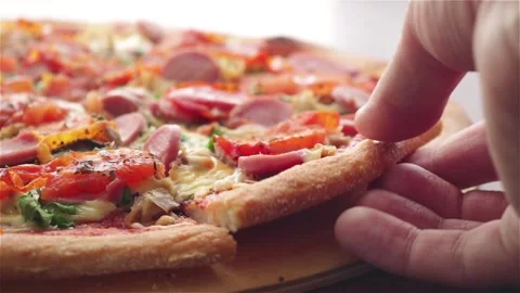Hand take hot  pizza slice with sausage tomatoes cheese extreme close up Stock Footage 113755742