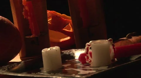 Hand take lighter and light candles on Halloween table with pumpkins Stock Footage 68019218