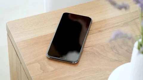 Hand Take a mobile phone from the table Stock Footage 120694116