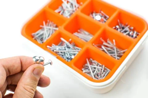 Hand take nails Stock Photos