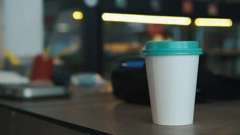 Hand take out coffee cup from table, grab and go Stock Footage 119236854