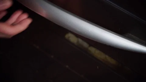 Hand take vegetables out of the oven 4K Stock Footage