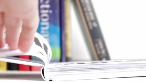 Hand Takes Book from Shelf, Opens and Flips Pages, Beginning Research Stock Footage 318740132