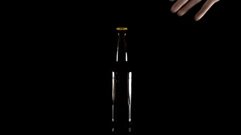 Hand takes a bottle of beer Stock Footage 98755755