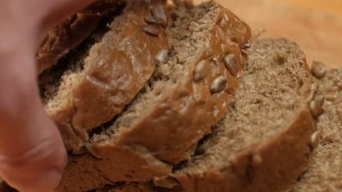 Hand takes bread Stock Footage 82669760