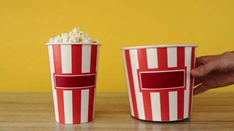 Hand takes buckets with popcorn Stock-Footage 150402535