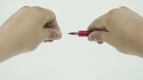 Hand takes a cap from a syringe Stock Footage 106677194