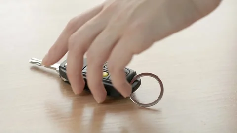 Hand takes the car keys Stock Footage 148823672