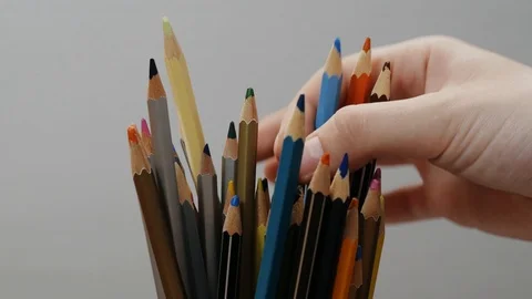 Hand takes colorful pencils from stack , process of drawing, art, creation. Stock Footage 106565519