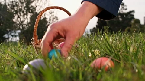 Hand takes easter eggs from the grass Stock Footage 267749568