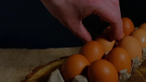 Hand takes egg from carton Stock Footage 124749512