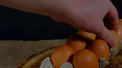 Hand takes egg from carton Stock Footage 124749537