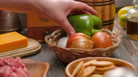 Hand takes green pepper Preparing homemade meatloaf with all ingredients Stock Footage 315417441