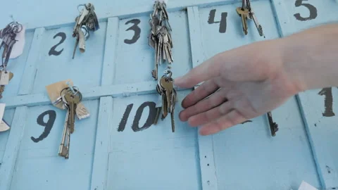 Hand Takes A Key From A Rack Of Keys From The Hotel Rooms Stock Footage 268178591