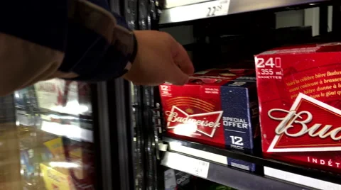 A hand takes one box of Budweiser from freezer Stock Footage 57653082