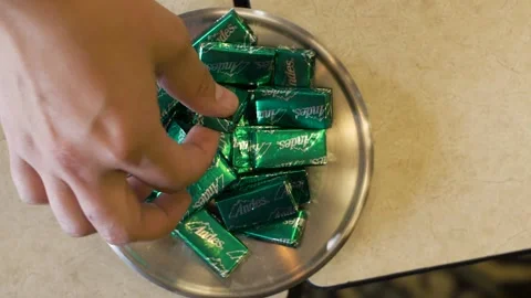 Hand takes one mint 스톡 동영상 136952713