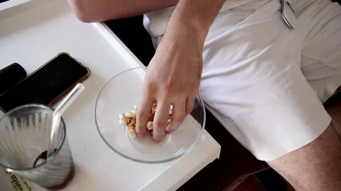 Hand takes popcorn Stock Footage 249000408