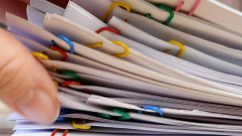 Hand takes stack of documents with binder clips wooden table 스톡 동영상 152583819