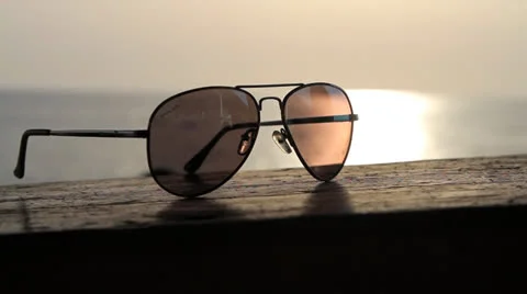 Hand takes sunglasses Stock Footage 25976819
