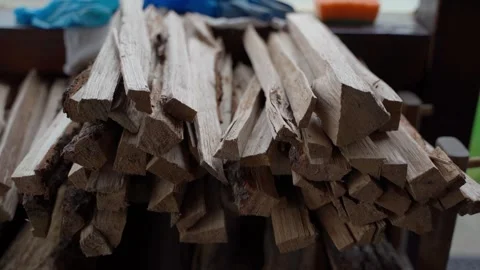 Hand takes thin firewood to start a fire, close-up Stock Footage 322170289