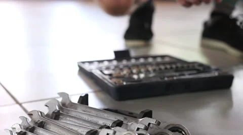Hand takes a wrench Stock Footage 65971206