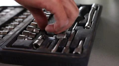 Hand takes a wrench Stock Footage 65972375