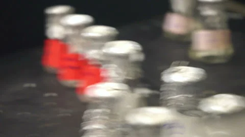 Hand takes/puts beaker Stock Footage 39843086