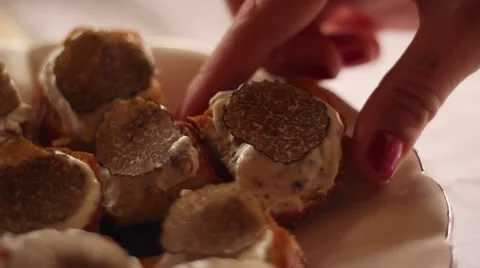 Hand taking a canape with truffles Stock-Footage 47211229