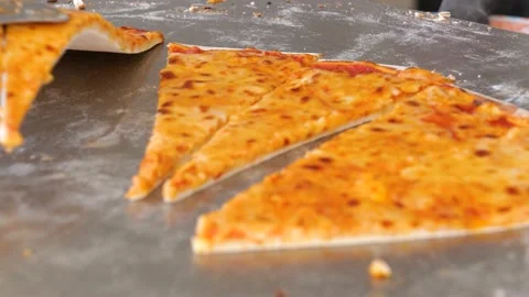 Hand taking cheese pizzas slices via spatula. Fast-food concept. Stock-Footage 153961401