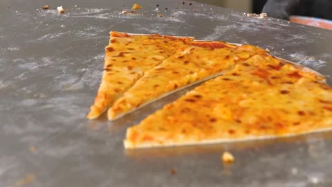 Hand taking cheese pizzas slices via spatula. Fast-food concept. Stock Footage 153961652