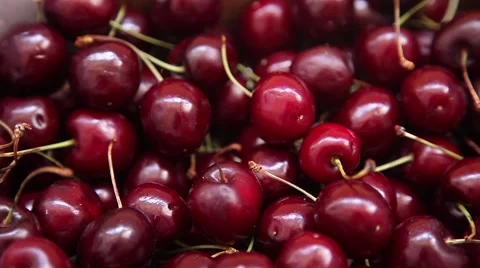 Hand taking cherries from box Stock Footage 64722470